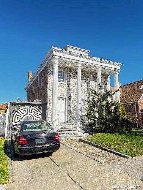 neoclassical / greek revival house with a front yard