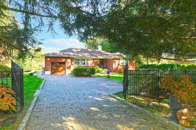 view of front facade featuring a front yard and a garage