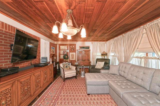 living room featuring wood ceiling, a chandelier, and brick wall