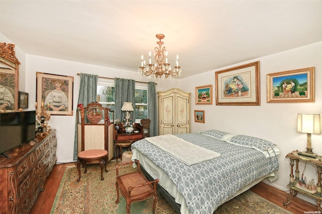 bedroom featuring a chandelier and dark hardwood / wood-style floors