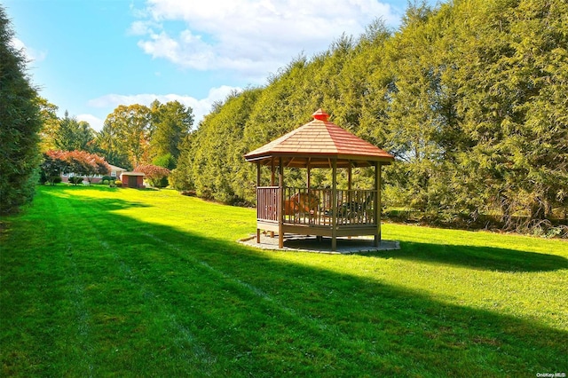 view of property's community featuring a gazebo and a yard