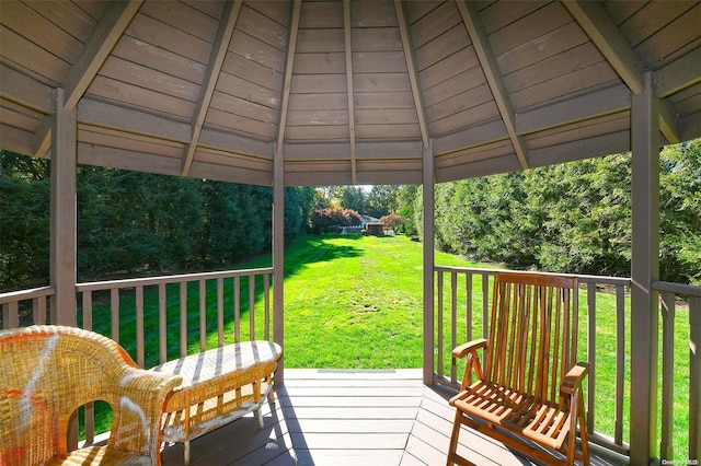 deck featuring a gazebo and a yard