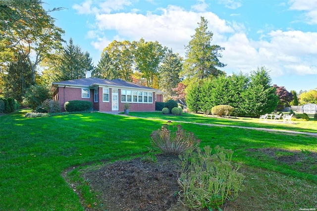 view of front of home with a front yard