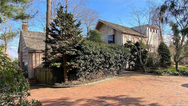 267 Great River Rd, Great River, NY 11739 - view of side of property with a chimney
