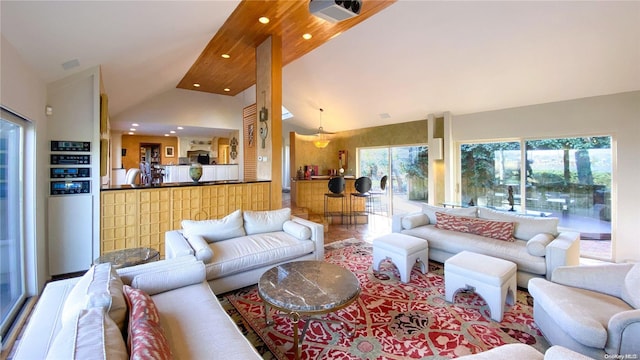 living room with high vaulted ceiling