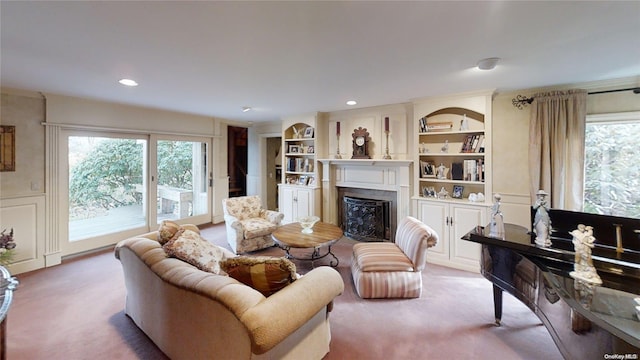 carpeted living room with built in shelves