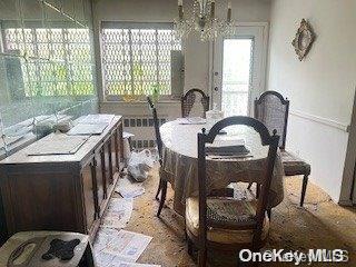 dining area featuring an inviting chandelier