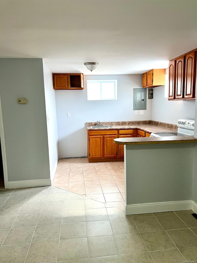 kitchen featuring white electric stove, light tile patterned flooring, sink, and kitchen peninsula