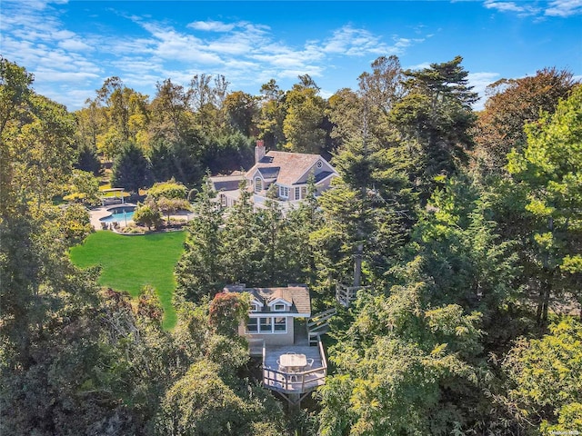 300 Maple St, Islip, NY 11751 - view of subject property featuring a heavily wooded area and a pool