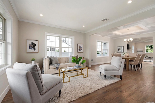 living room featuring plenty of natural light, ornamental molding, and dark wood-type flooring