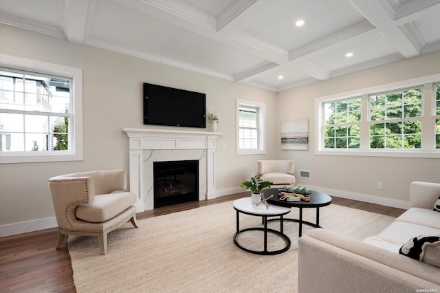 living room featuring hardwood / wood-style flooring, beam ceiling, crown molding, and coffered ceiling