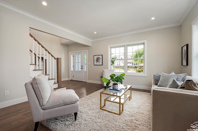 living room featuring dark hardwood / wood-style floors and ornamental molding