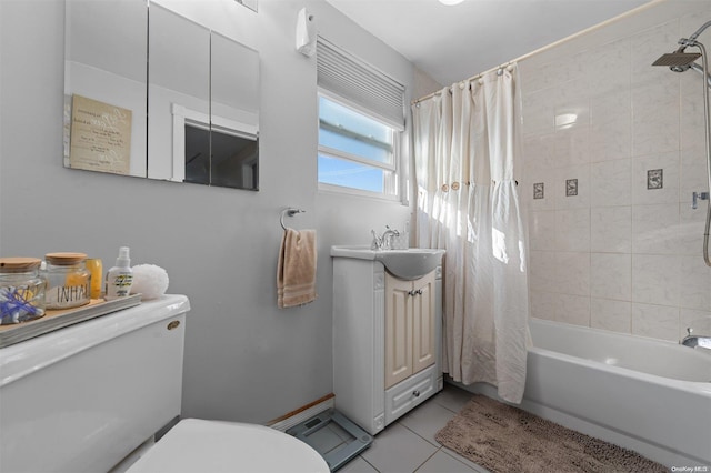 full bathroom featuring tile patterned floors, vanity, toilet, and shower / tub combo with curtain