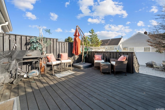 wooden deck featuring area for grilling