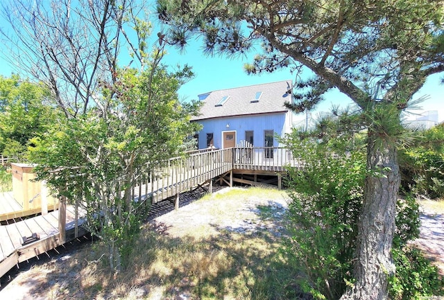 25 5th, Fair Harbor, NY 11706 - rear view of property with a wooden deck and a shingled roof