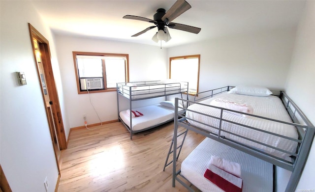 25 5th, Fair Harbor, NY 11706 - bedroom featuring light wood-style flooring, cooling unit, and a ceiling fan