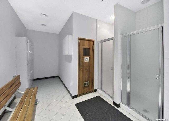 bathroom featuring tile patterned floors and an enclosed shower