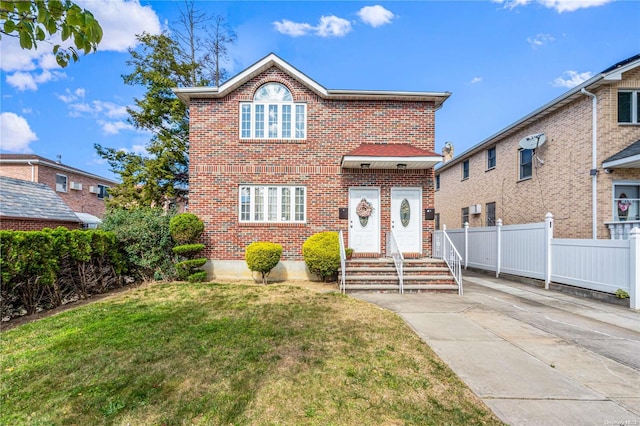 front facade with a front yard