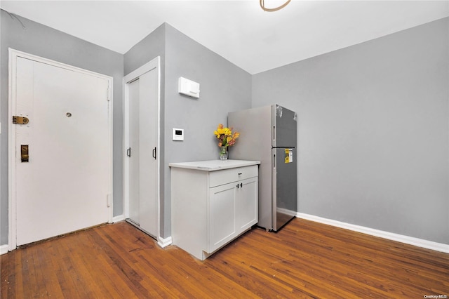 interior space with dark hardwood / wood-style flooring