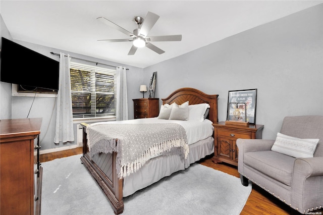 bedroom with light wood-type flooring and ceiling fan