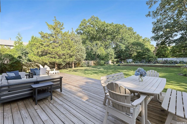 deck featuring a yard and an outdoor living space