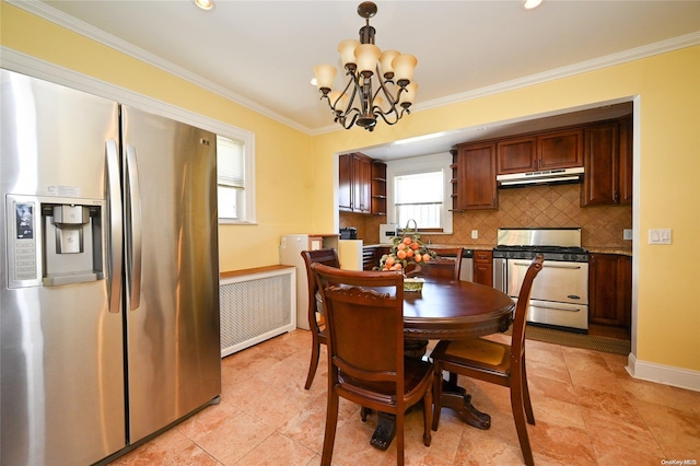 dining room featuring radiator, crown molding, and an inviting chandelier