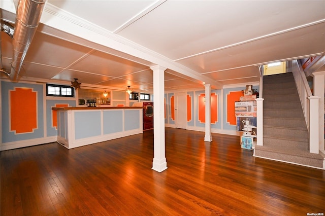 basement featuring dark hardwood / wood-style flooring