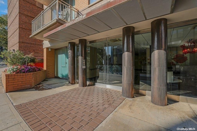 entrance to property with a balcony