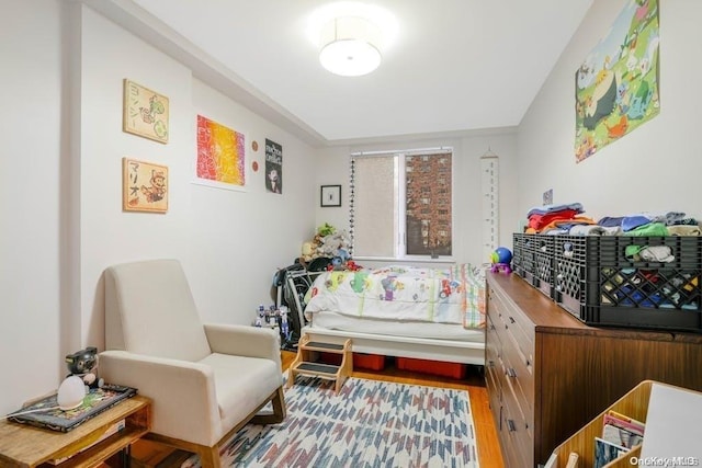 bedroom with wood-type flooring