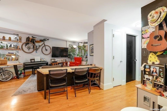 dining area with light hardwood / wood-style floors