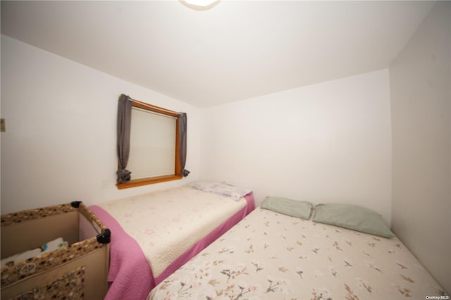 bedroom with vaulted ceiling