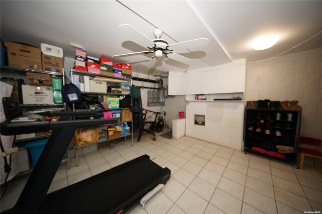 kitchen with white cabinets, ceiling fan, and light tile patterned flooring