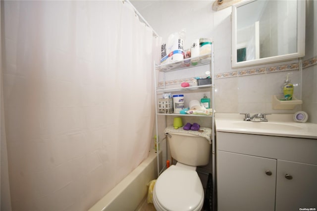 full bathroom with decorative backsplash, shower / bath combination with curtain, toilet, and vanity