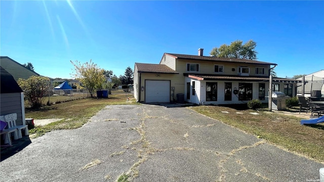 view of front property with covered porch and a garage