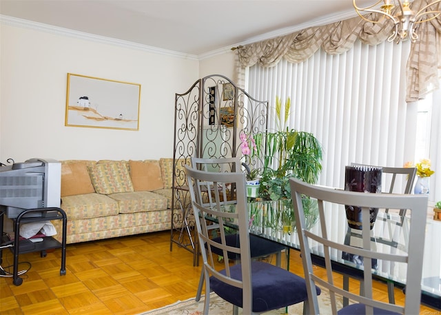 dining room with parquet floors, crown molding, and a notable chandelier