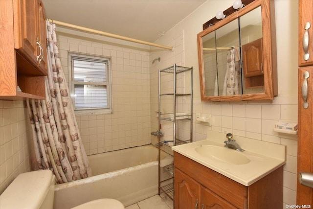 full bathroom with backsplash, toilet, shower / bath combo with shower curtain, vanity, and tile walls