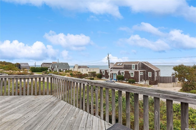 wooden terrace with a water view