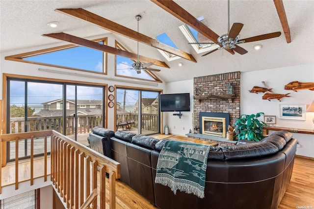 21 Captain Kidds Path, Montauk, NY 11954 - living area with a ceiling fan, a skylight, light wood-style flooring, healthy amount of natural light, and a textured ceiling