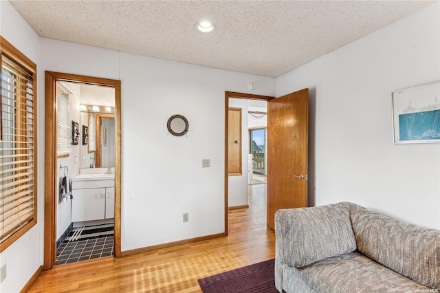 21 Captain Kidds Path, Montauk, NY 11954 - sitting room with a textured ceiling, light wood-type flooring, and recessed lighting