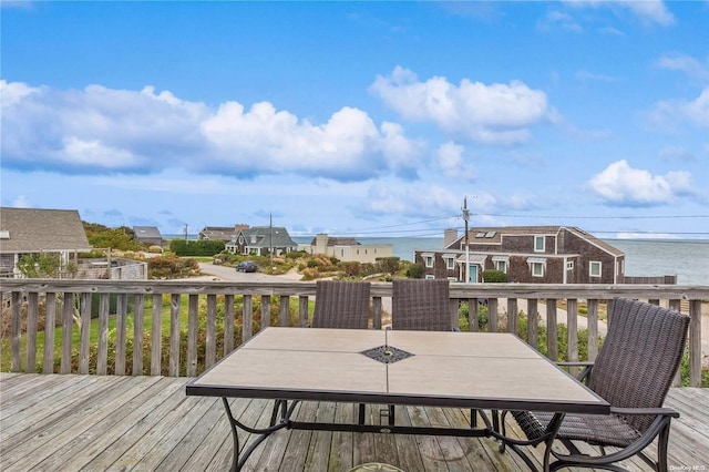 21 Captain Kidds Path, Montauk, NY 11954 - wooden terrace featuring outdoor dining space and a residential view