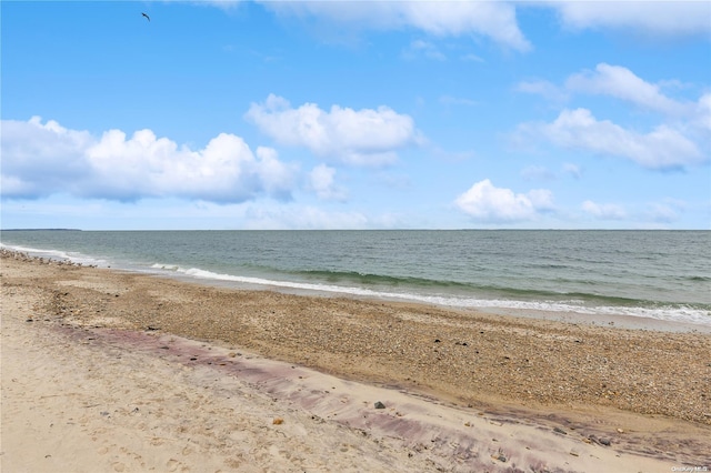 view of water feature with a beach view