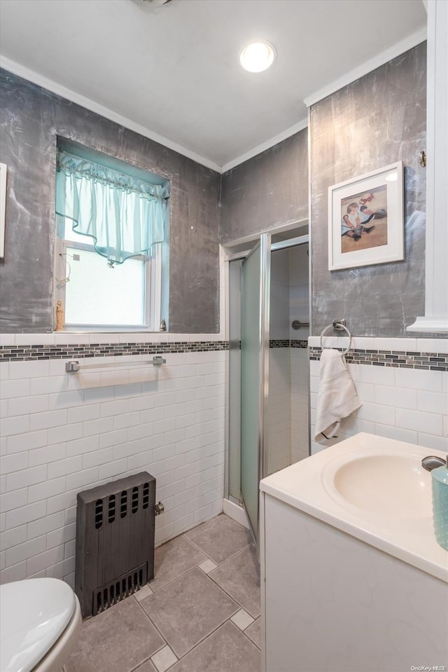 bathroom with walk in shower, radiator heating unit, and tile walls