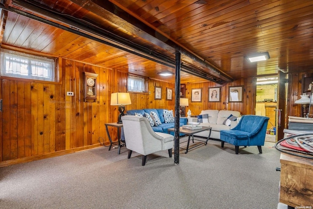 carpeted living room featuring wood walls and wooden ceiling