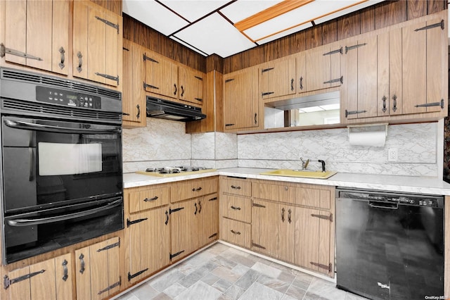 kitchen featuring decorative backsplash, sink, and black appliances