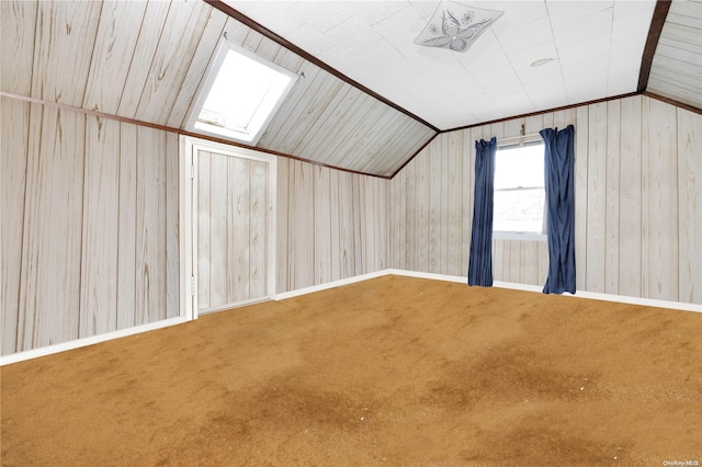 bonus room featuring carpet, lofted ceiling, and wood walls