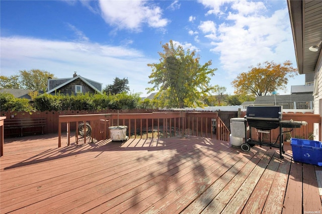 wooden deck featuring area for grilling