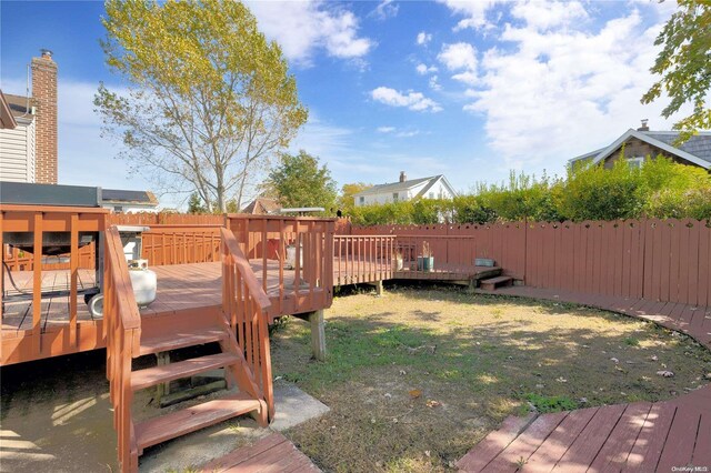 view of yard featuring a wooden deck