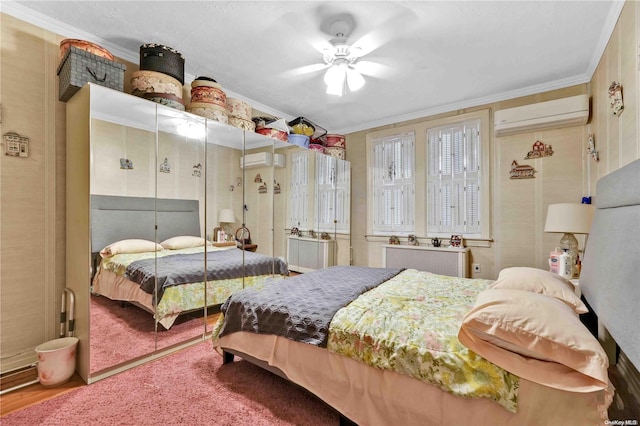 bedroom with radiator, ceiling fan, an AC wall unit, crown molding, and wood-type flooring