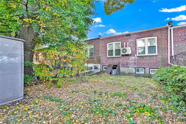 back of property featuring ac unit