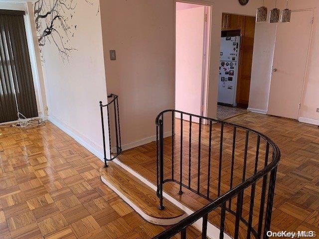 stairway with parquet flooring